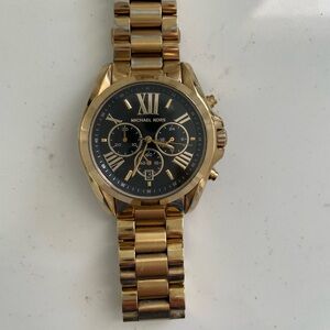 Michael Kors gold watch; black interior